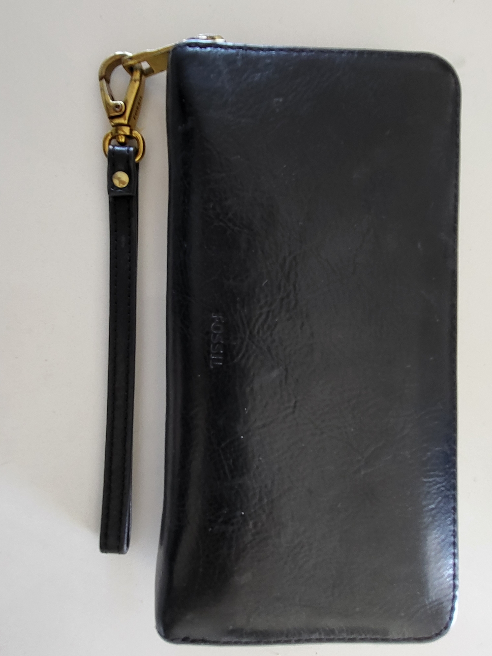 Fossil black leather wristlet, wallet, brass hardware